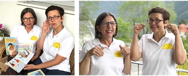 Edeltraud Matzohl und Valentine Inderst zeigen Beispiele aus der Zwergensprache, links:  „horch“ – Babyzeichen werden in den Zwergensprach-Kinderbüchern bildlich erläutert!; rechts: „Hund“ und „Katze“
